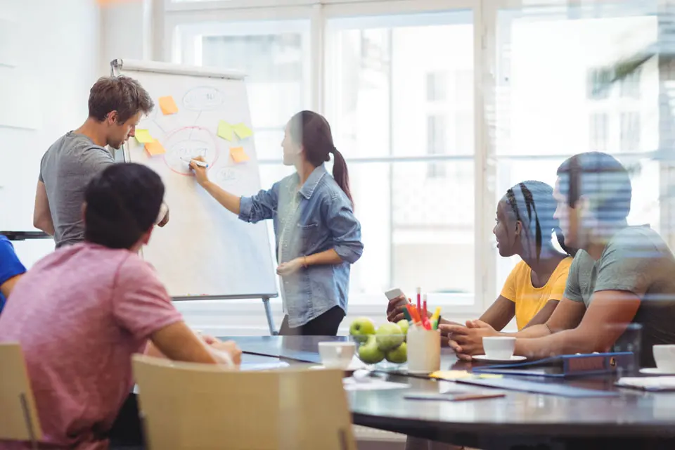 Colleagues working together in an office
